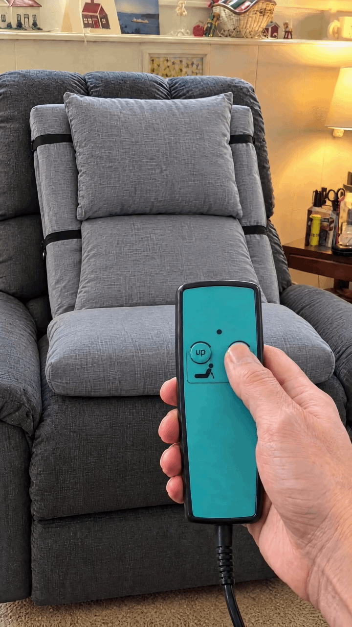 Restora on a recliner with the one-button remote